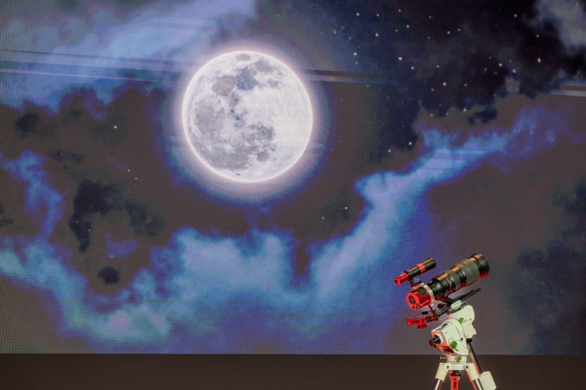 The moon, behind a telescope.