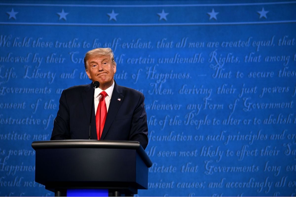 Donald Trump reacts during the final presidential debate